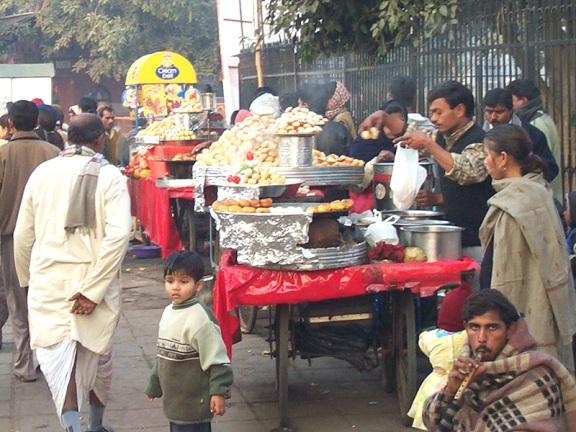 This picture was taken in 2003 and shows a street chaat vendor outside the Red Fort in New Delhi. This kind of informal establishment is still the major mode of chaat delivery in North India