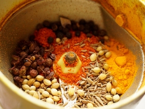 The spices for the sauce about to be ground.