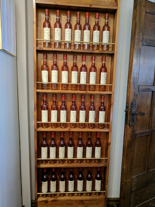 A wall of 500 ml bottles of vintage Armagnac from a producer by the name of Nismes-Delclou. I believe other than their own house bottlings these are the only Armagnacs they carry.