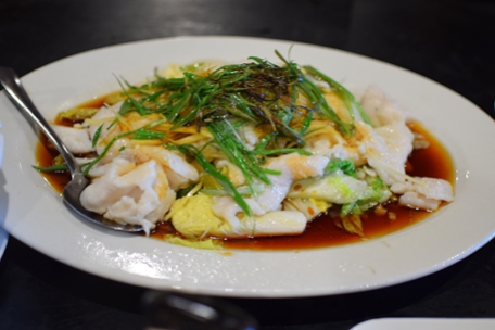 This is the regular steamed fish from the menu with ginger and lots of green onions.